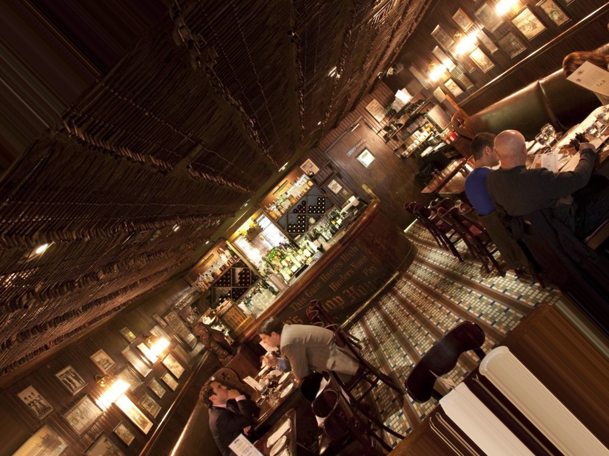 Enormous steaks and signature mutton chops served in a maze of clubby, wood-paneled rooms.